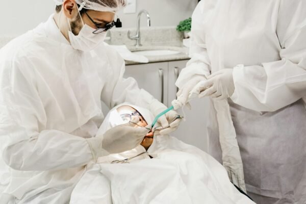 Emergency dentist treating patient at Madison Square Dental